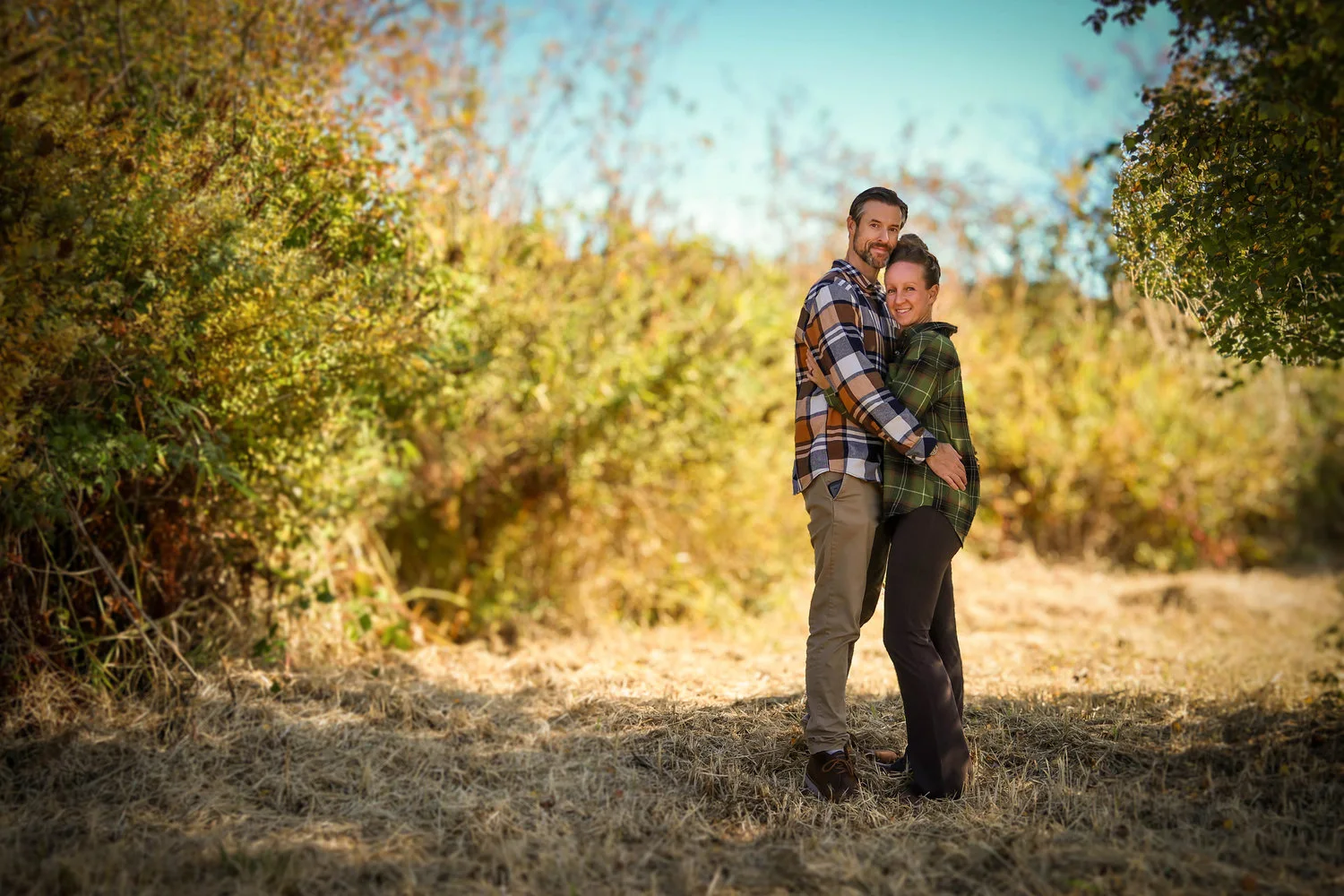 Mike and Emily together in warm autumn light